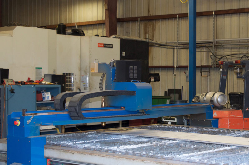 image of our plasma cutter and the bed it cuts on.